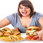 Woman eating fast food.