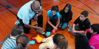 Sixth graders learn hands-only CPR in a better away with music and videos