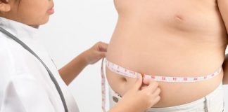 doctor-measuring-obese-child-waist-body-fat